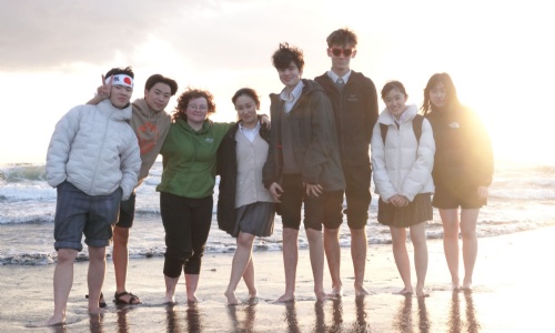 Stephen Perse and Keio students on the beach in Japan as part of the exchange programme