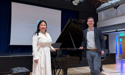 Rose Jiang, Stephen Perse Cambridge parent gifting a Steinway piano to the school, with Matthew Rudd, Director of Music