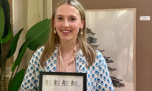 Amelia with her Arts Society Competition certificate